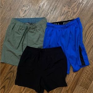 Three pairs of men’s size small athletic shorts